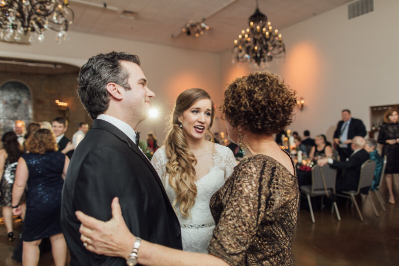 Relationship coach Kathy Rushing congratulating young couple at their wedding